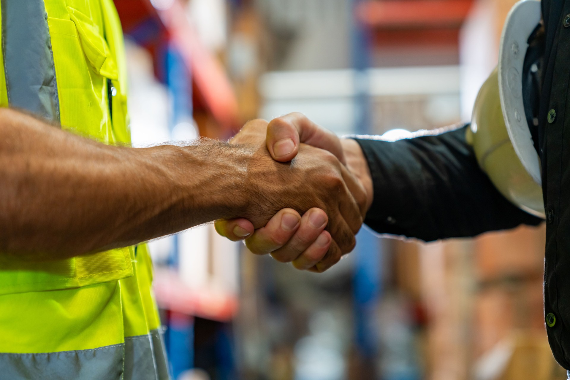 Caucasian man engineer working with manager in factory warehouse